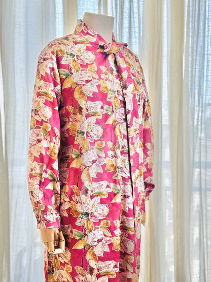 Mannequin wearing a floral dress with a pink background