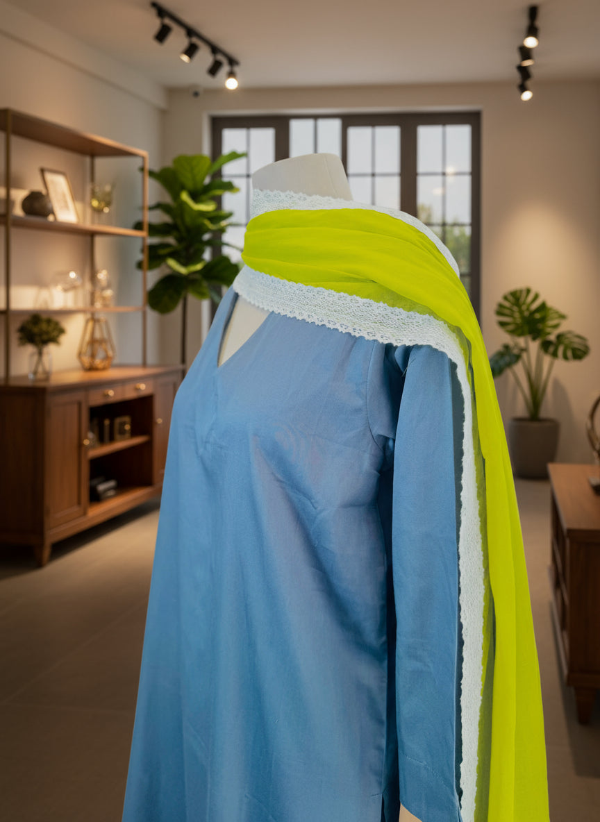 Mannequin wearing a blue dress with a yellow scarf draped over it against a plain background